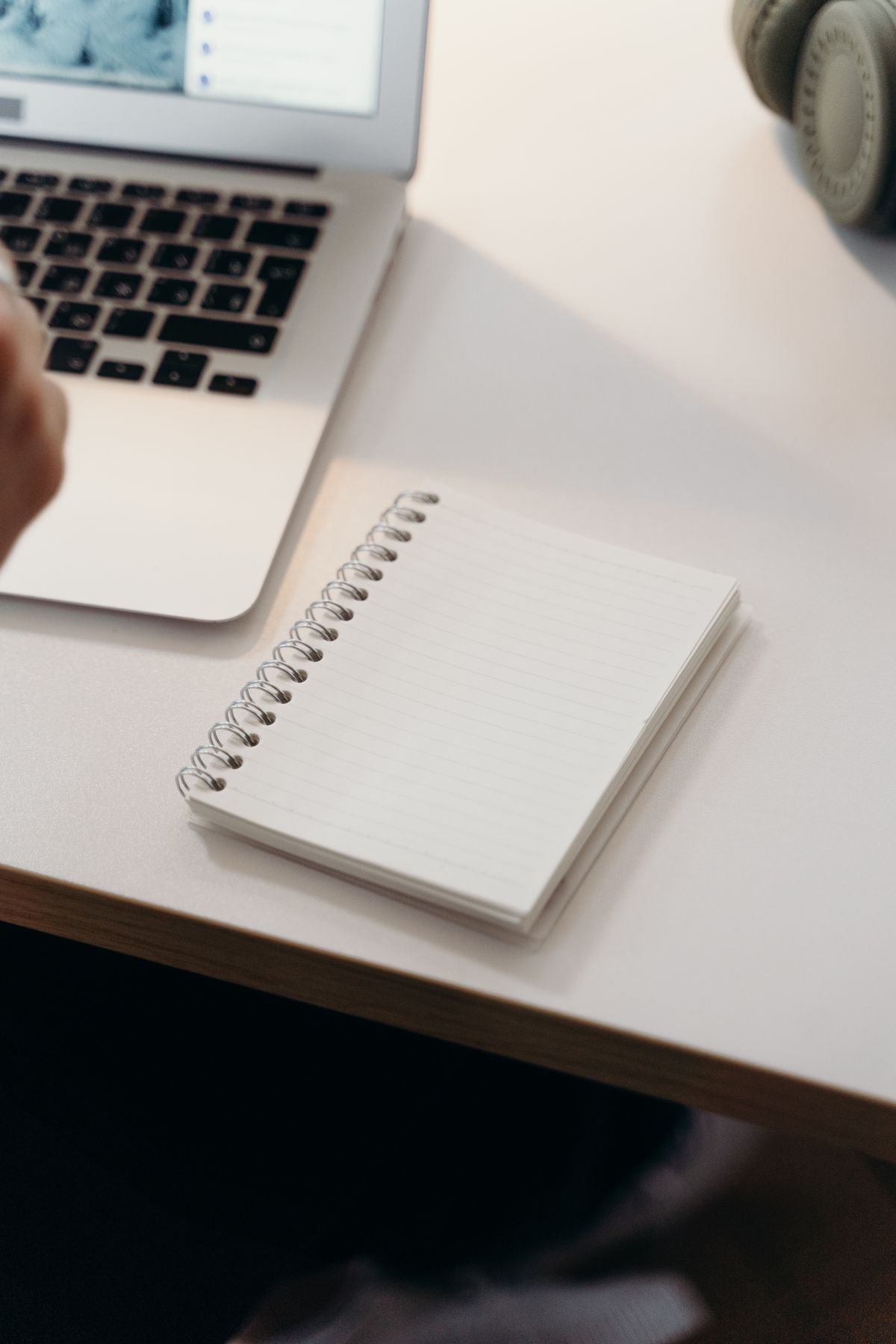 Notebook and laptop on a desk for focused work